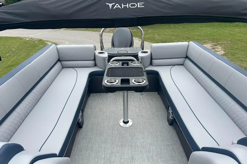 Slide: The Image of Luxurious 2025 Tahoe 2585 pontoon boat interior with plush seating and table. - 21