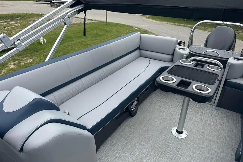 Slide: The Image of Luxurious seating area on 2025 Tahoe 2585 boat with cup holders and sleek design. - 22