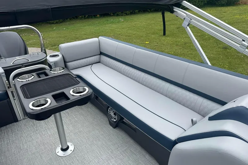 Slide: The Image of Luxurious seating area on 2025 Tahoe 2585 boat with cup holders and sleek design. - 23