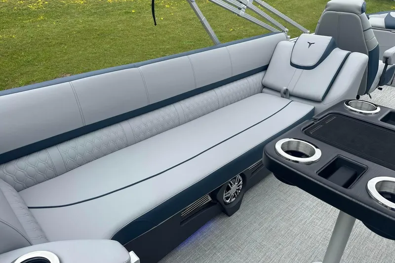 Slide: The Image of Luxurious seating on 2025 Tahoe 2585 boat with cup holders and sleek design. - 25