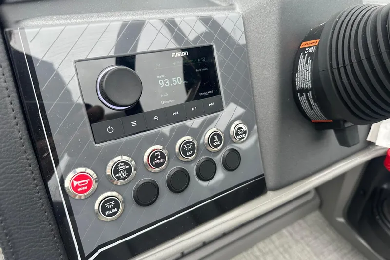 Slide: The Image of Dashboard of 2025 Tahoe 2585 with control panel and radio display. - 27