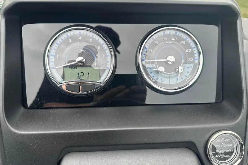 Slide: The Image of Dashboard of 2025 Tahoe 2585 with RPM and speedometer gauges. - 28