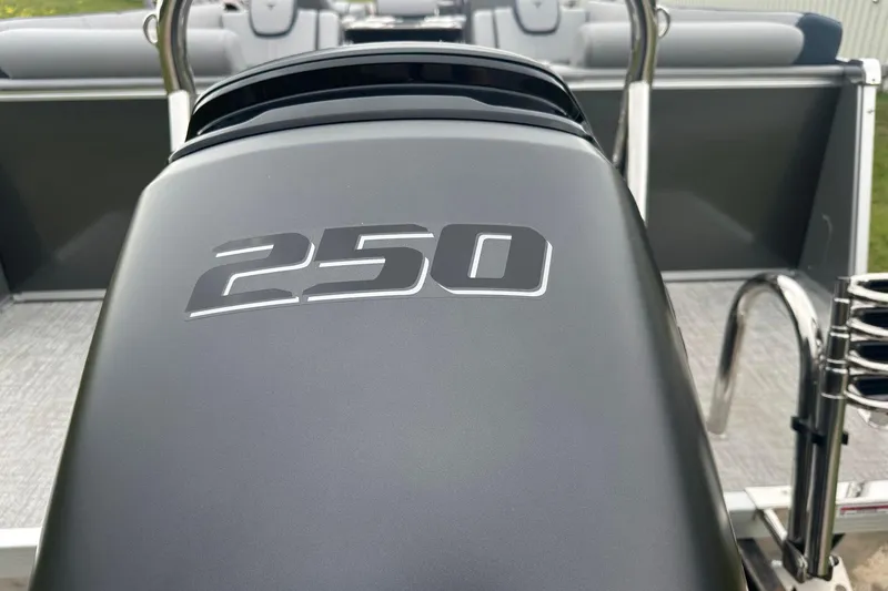 Slide: The Image of 2025 Tahoe 2585 boat engine cover with "250" marking, sleek design. - 6