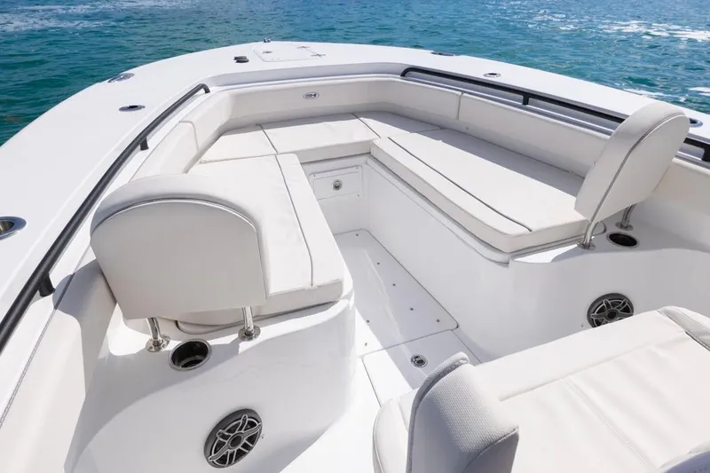Slide: The Image of 2026 Sea Hunt Gamefish 28 Forward Seating boat interior with white cushioned seats. - 12