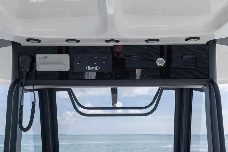 Slide: The Image of 2026 Sea Hunt Gamefish 28 console with Garmin equipment, ocean view in background. - 18