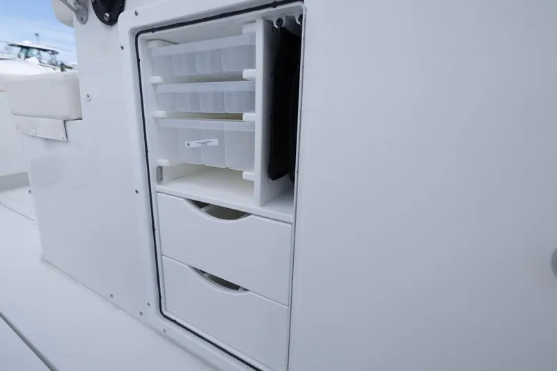 Slide: The Image of 2026 Sea Hunt Gamefish 28 storage compartment with drawers and tackle boxes. - 21