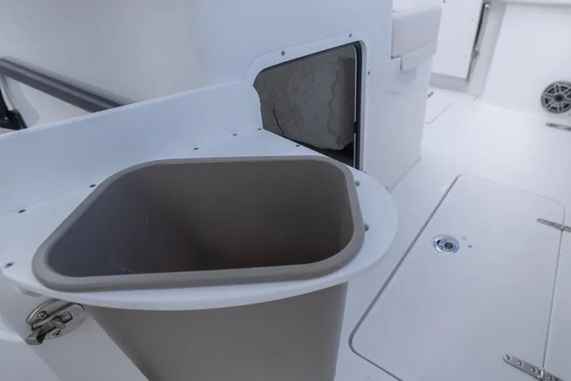 Slide: The Image of 2026 Sea Hunt Gamefish 28 Forward Seating boat interior with storage compartment. - 22