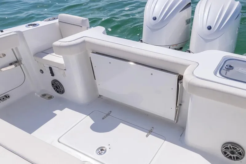 Slide: The Image of 2026 Sea Hunt Gamefish 28 boat interior with seating and dual Yamaha engines. - 29