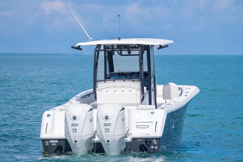 Slide: The Image of 2026 Sea Hunt Gamefish 28 boat with twin Yamaha engines on open water. - 3