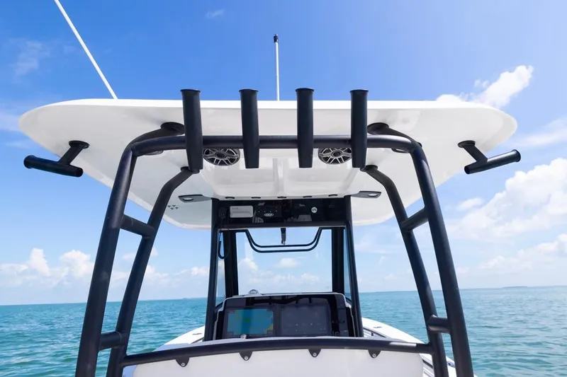 Slide: The Image of 2026 Sea Hunt Gamefish 28 boat with forward seating, ocean view, and clear blue sky. - 31