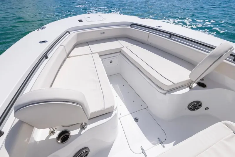 Slide: The Image of 2026 Sea Hunt Gamefish 28 Forward Seating, luxurious white seating, ocean backdrop. - 7