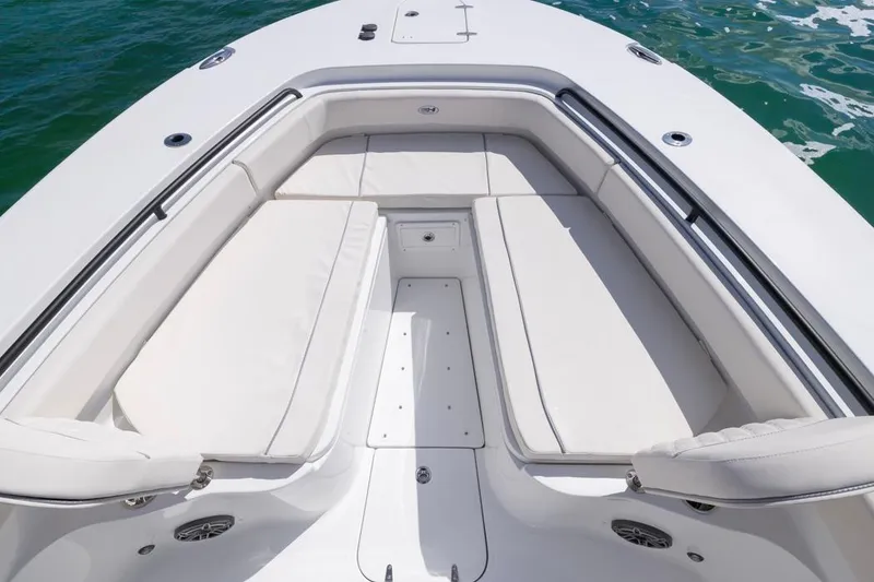 Slide: The Image of 2026 Sea Hunt Gamefish 28 Forward Seating, spacious white seating area on a boat. - 8