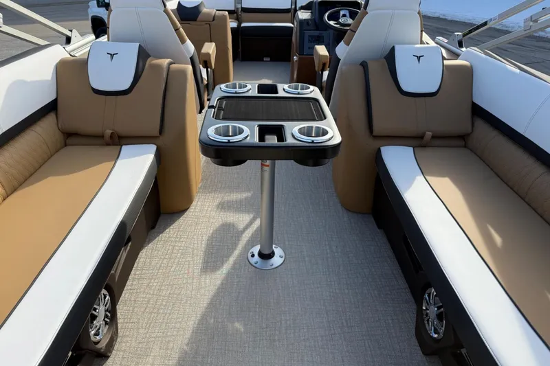 Slide: The Image of Luxurious interior of 2025 Tahoe 2585 boat with plush seating and cup holders. - 11