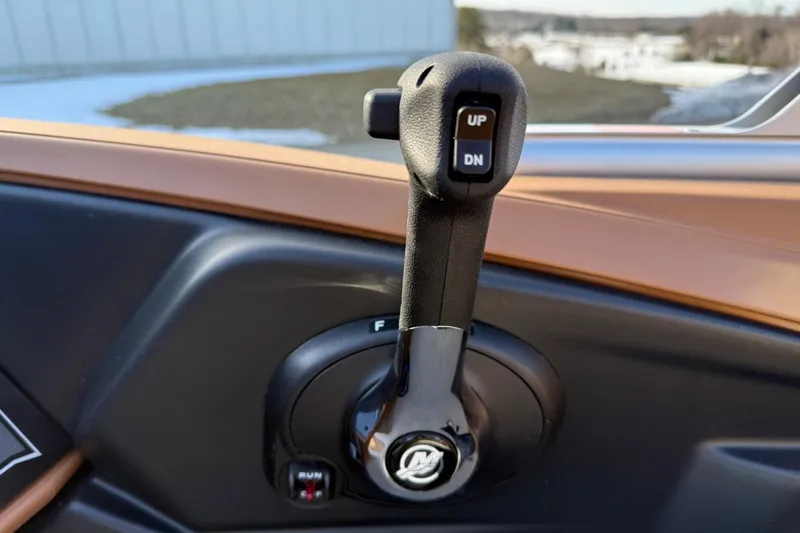 Slide: The Image of Throttle control lever on 2025 Tahoe 2585 boat dashboard. - 19