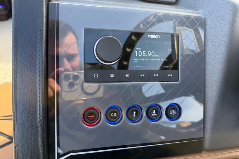 Slide: The Image of Control panel of a 2025 Tahoe 2585 with Fusion audio system display. - 21