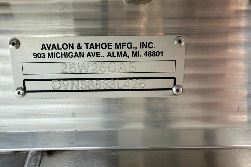 Slide: The Image of Metal plate with Avalon & Tahoe Mfg. details, model 25W25GAS, serial DVN68833L425. - 8