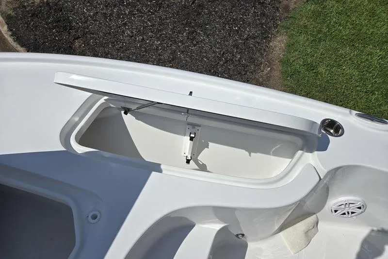 Slide: The Image of 2026 Sea Hunt BX 22 BR boat storage compartment with open lid, showcasing interior space. - 14