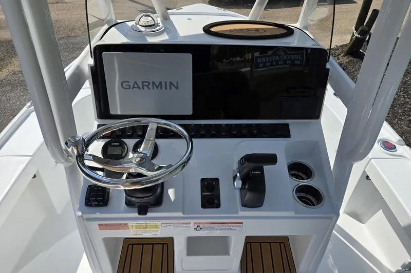 Slide: The Image of 2026 Sea Hunt BX 22 BR boat console with Garmin display and steering wheel. - 15