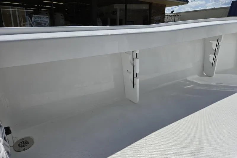 Slide: The Image of 2026 Sea Hunt BX 22 BR boat interior, showcasing clean white deck and storage compartments. - 18