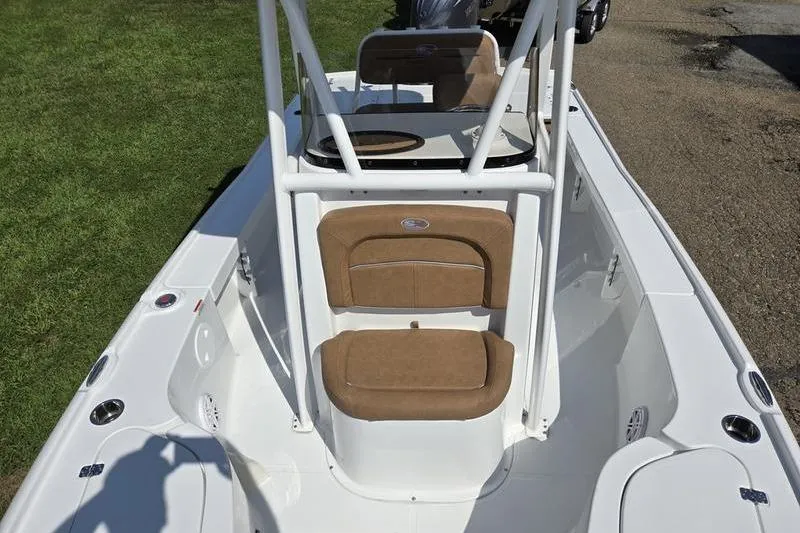 Slide: The Image of 2026 Sea Hunt BX 22 BR boat interior with tan seating and white console. - 19