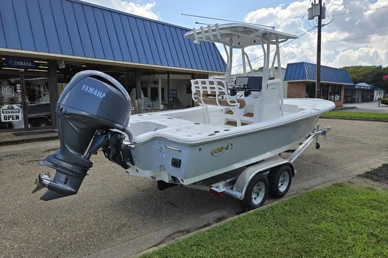 Slide: The Image of 2026 Sea Hunt BX 22 BR boat on trailer, featuring Yamaha outboard motor. - 3