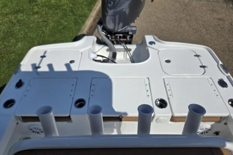 Slide: The Image of 2026 Sea Hunt BX 22 BR boat deck with rod holders and motor. - 4