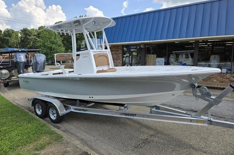Slide: The Image of 2026 Sea Hunt BX 22 BR boat on trailer outside dealership. - 6