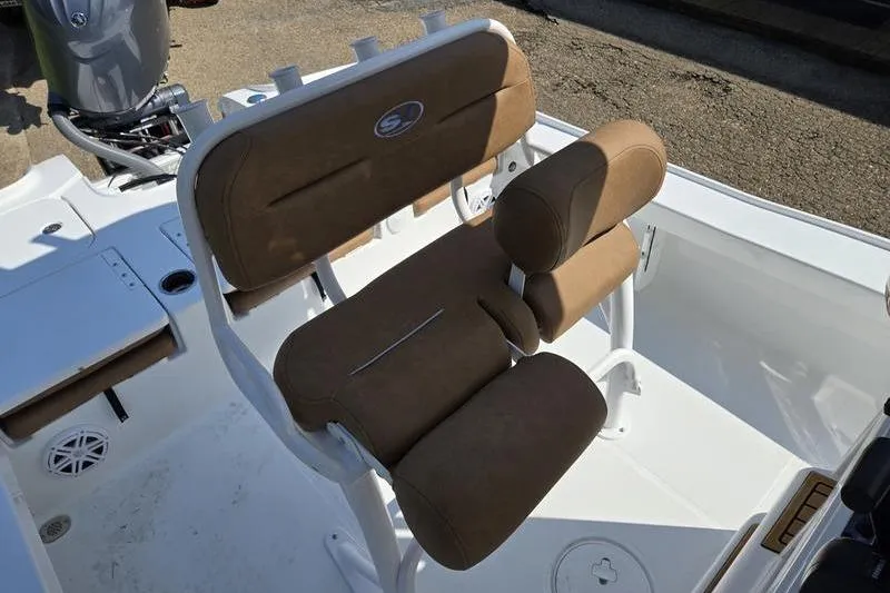 Slide: The Image of 2026 Sea Hunt BX 22 BR boat with tan cushioned seating and white deck. - 8