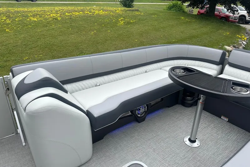 Slide: The Image of 2025 Tahoe 2585 boat interior with sleek seating and modern table design. - 15