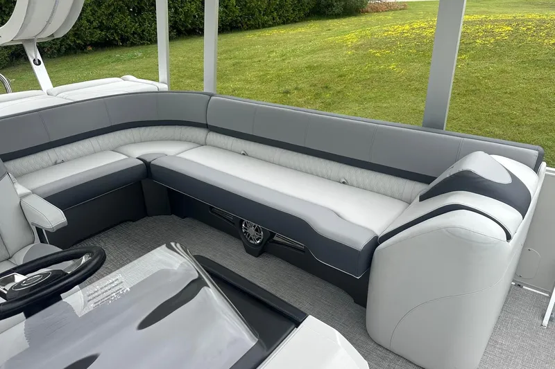 Slide: The Image of 2025 Tahoe 2585 boat interior with sleek gray seating and modern design. - 19