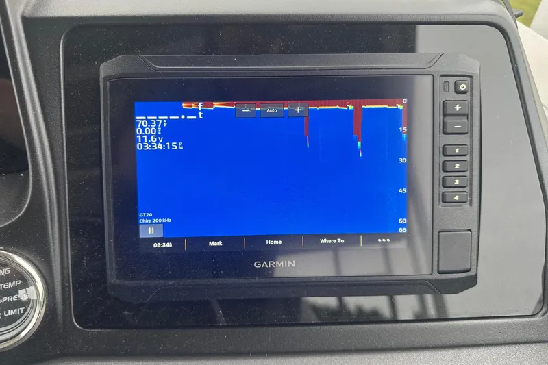 Slide: The Image of Garmin fishfinder display on a 2025 Tahoe 2585, showing depth and temperature readings. - 25