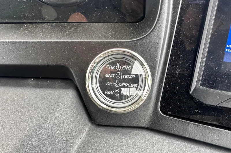 Slide: The Image of Dashboard gauge of 2025 Tahoe 2585, displaying engine and oil indicators. - 26