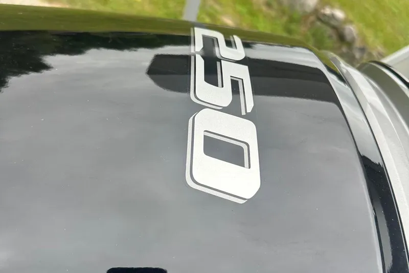 Slide: The Image of Close-up of 2025 Tahoe 2585 engine cover with "250" decal. - 7