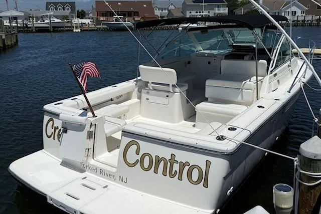 The Image of 1999 Tiara Yachts 2900 Coronet docked in Forked River, NJ, with American flag. - 0