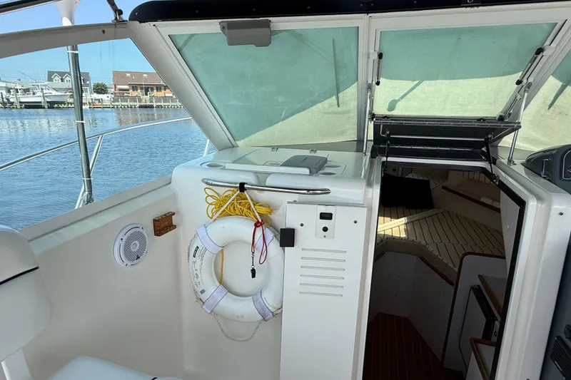 Slide: The Image of 1999 Tiara Yachts 2900 Coronet interior with life preserver and cabin view. - 10