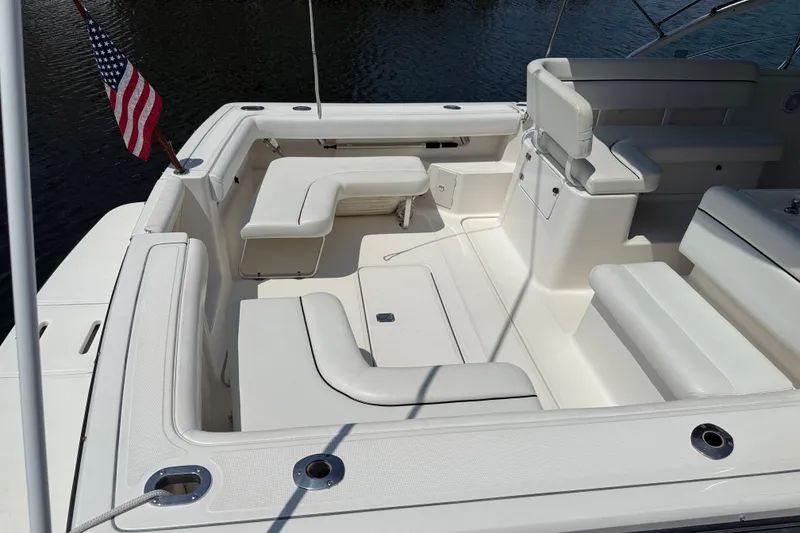 Slide: The Image of 1999 Tiara Yachts 2900 Coronet boat interior with seating and American flag. - 2