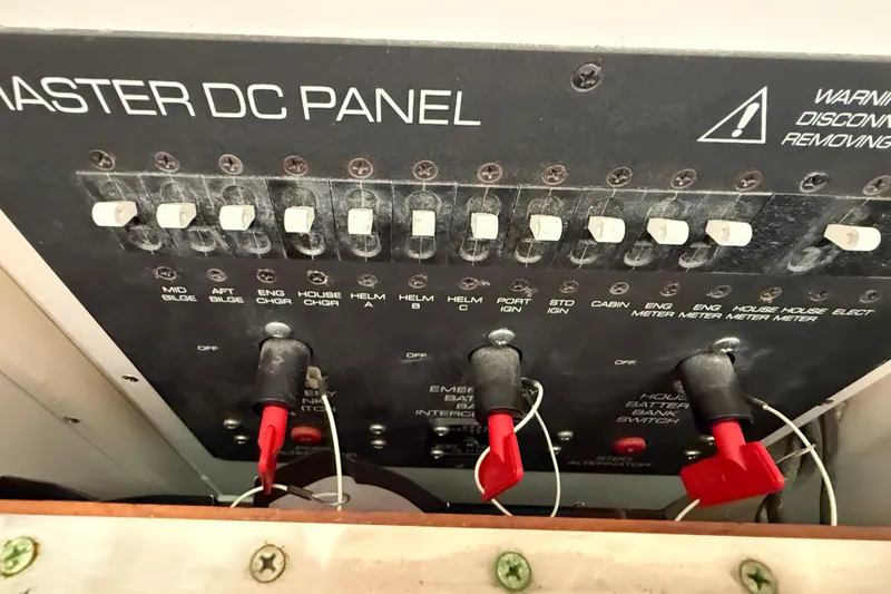 Slide: The Image of Master DC panel of 1999 Tiara Yachts 2900 Coronet with switches and warning label. - 20