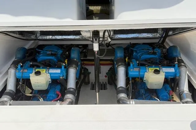 Slide: The Image of 1999 Tiara Yachts 2900 Coronet engine compartment with dual blue engines. - 21