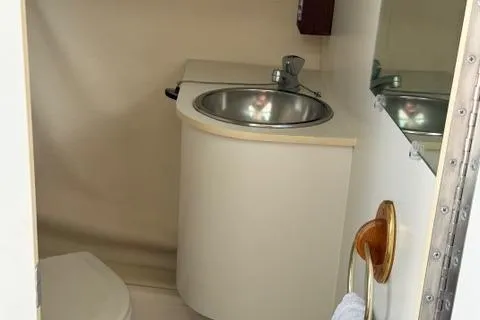 Slide: The Image of 1999 Tiara Yachts 2900 Coronet bathroom with sink and mirror. - 30