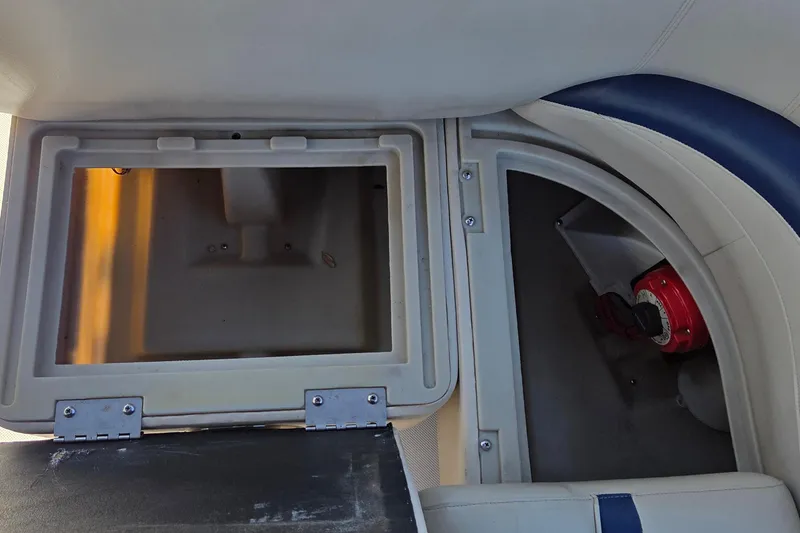 Slide: The Image of 2014 Hurricane FunDeck 216 OB storage compartments and seating area. - 11