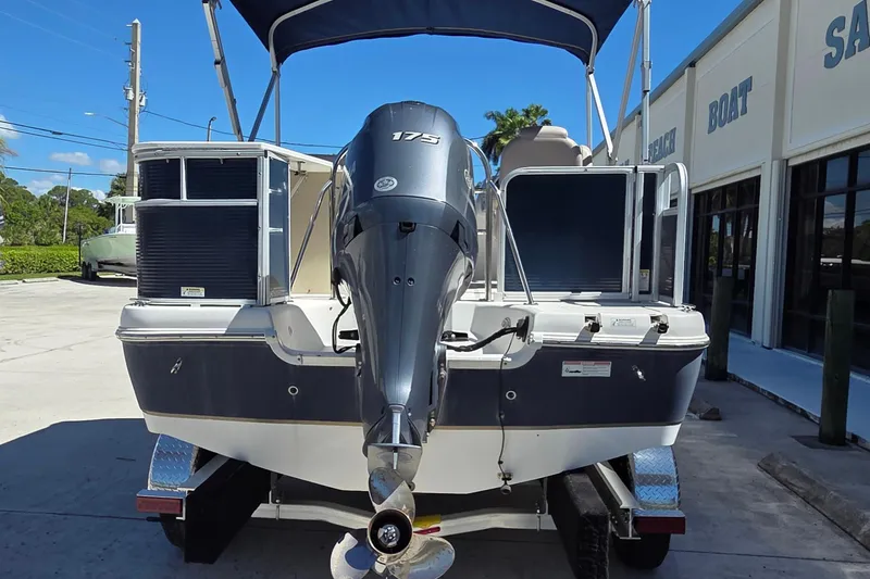 Slide: The Image of 2014 Hurricane FunDeck 216 OB boat with 175 HP outboard motor on trailer. - 2
