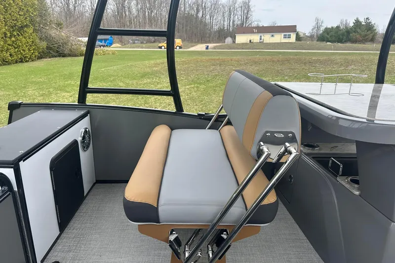 Slide: The Image of 2025 Tahoe 2785 boat interior with modern seating and sleek design. - 15