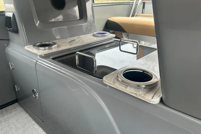 Slide: The Image of Interior of 2025 Tahoe 2785 boat with cup holders and sleek design. - 16