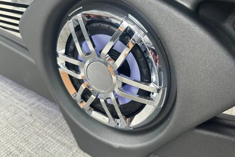 Slide: The Image of Close-up of a 2025 Tahoe 2785 speaker with chrome grille design. - 17