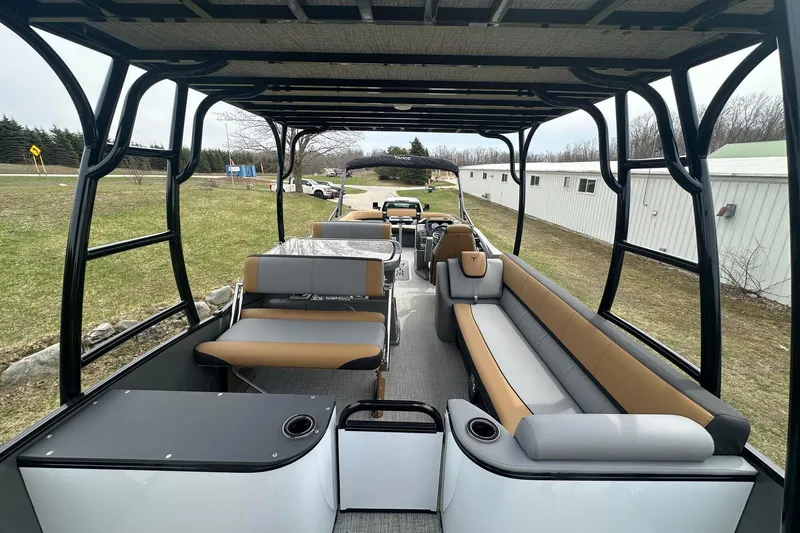 Slide: The Image of 2025 Tahoe 2785 pontoon boat interior with spacious seating and modern design. - 18