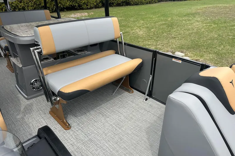 Slide: The Image of 2025 Tahoe 2785 boat interior with gray and tan seating, featuring a sleek design. - 21