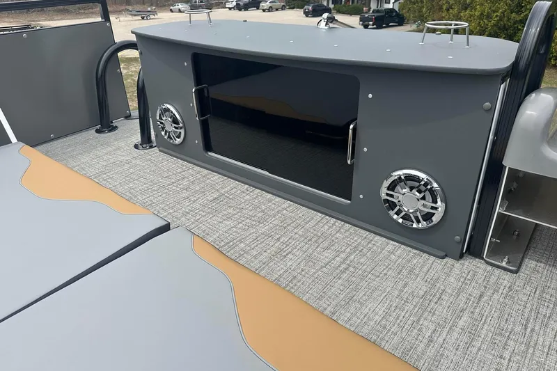 Slide: The Image of 2025 Tahoe 2785 boat interior with sleek design, modern speakers, and comfortable seating. - 22