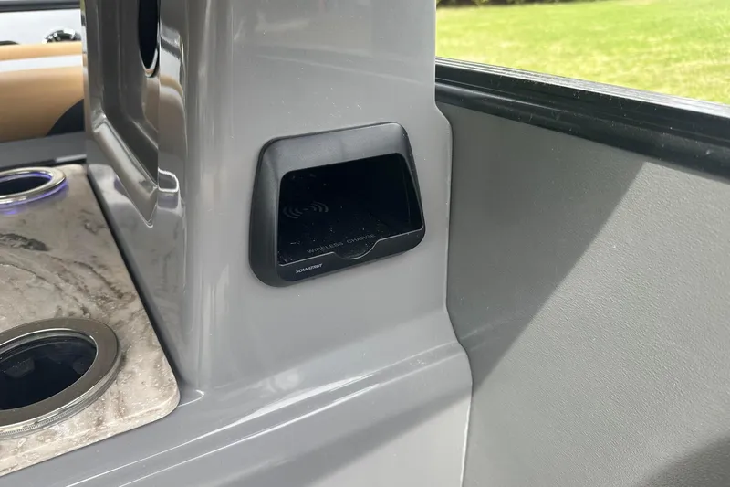 Slide: The Image of 2025 Tahoe 2785 interior with wireless charging station and cup holders. - 23