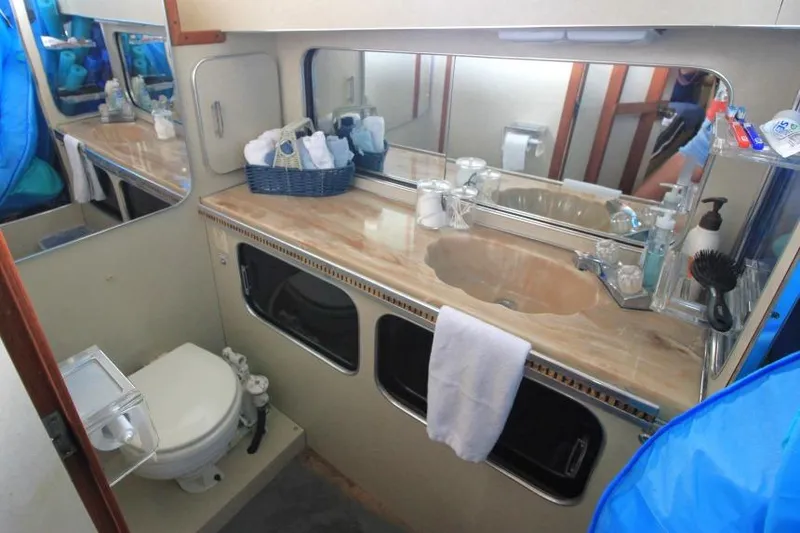 Slide: The Image of Bathroom interior of 1983 Chris-Craft 350 Catalina yacht with sink, mirror, and toilet. - 18
