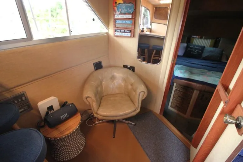 Slide: The Image of Interior of 1983 Chris-Craft 350 Catalina with cozy seating and bedroom view. - 21